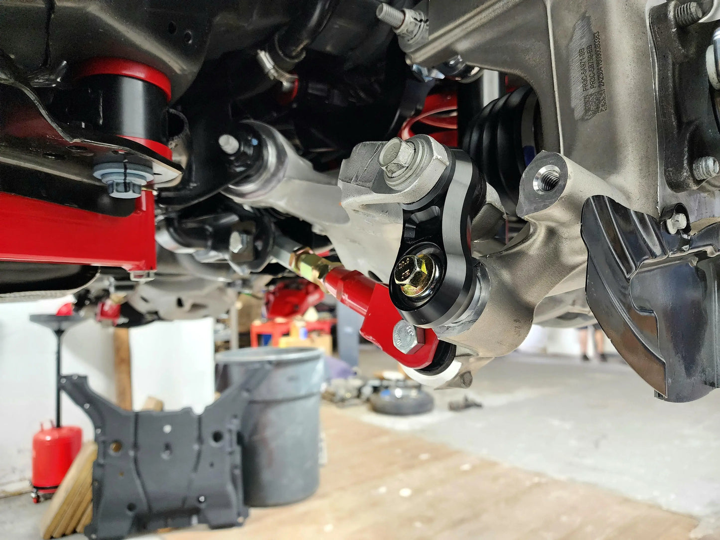 Vertical link, rear lower control arms, delrin/bearing combo